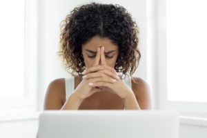 woman under stress at a computer